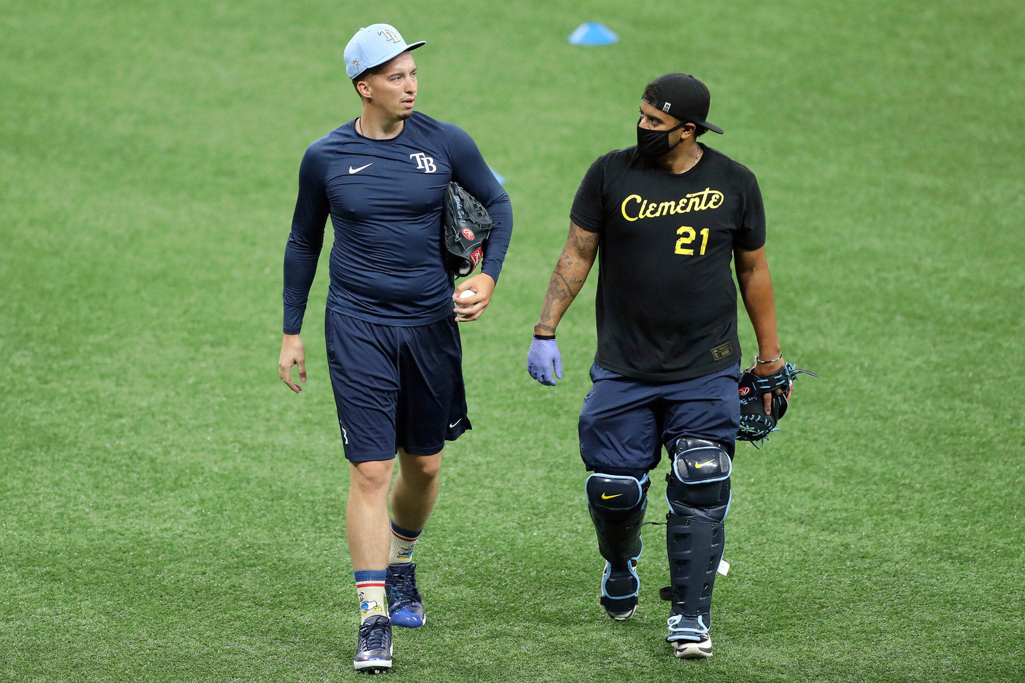 Rays pitcher Blake Snell (left), a Shorewood High School alum, talks with bullpen catcher Jean Ramirez during practice on July 3, 2020, in St. Petersburg, Fla. (AP Photo/Mike Carlson)