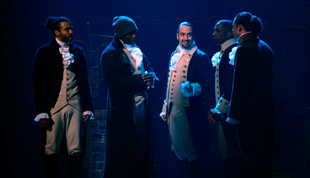 From left, Daveed Diggs, Okieriete Onaodowan, Lin-Manuel Miranda, Leslie Odom Jr. and Anthony Ramos appear in a filmed version of the original Broadway production of “Hamilton.” (Disney Plus via AP)
