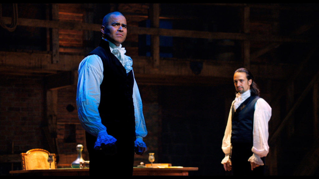 Chris Jackson portrays George Washington (left) and Lin-Manuel Miranda portrays Alexander Hamilton in a filmed version of the original Broadway production of “Hamilton.” (Disney Plus via AP)
