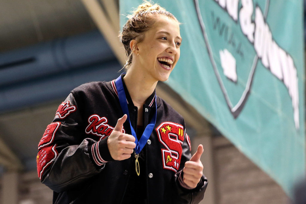 Snohomish’s Kayli Kersavage gives a thumbs-up after taking first place in the 1 meter diving competition during the Class 3A Girls Swim & Dive Championships at King County Aquatics Center in Federal Way on Nov. 16, 2019. (Kevin Clark / The Herald)
