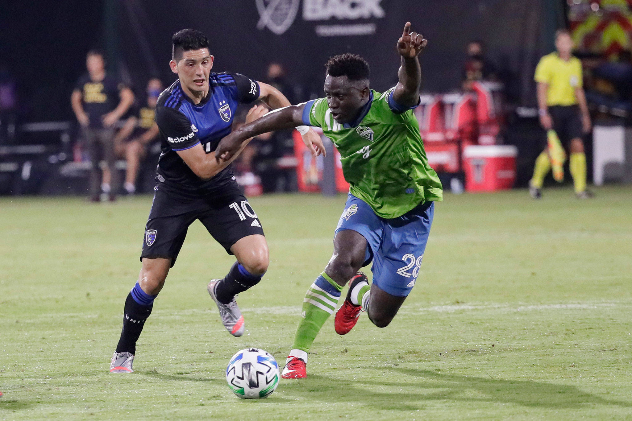Sounders defender Yeimar Gomez Andrade (right) battles for possession of the ball with Earthquakes forward Cristian Espinoza (10) during the second half of an MLS match July 10, 2020, in Kissimmee, Fla. (AP Photo/John Raoux)