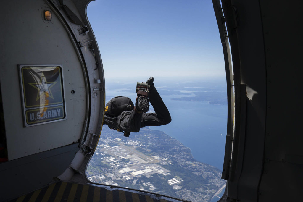 The last jumper with the U.S. Army Golden Knights begins his skydive to Providence Regional Medical Center. (Andy Bronson / The Herald)
