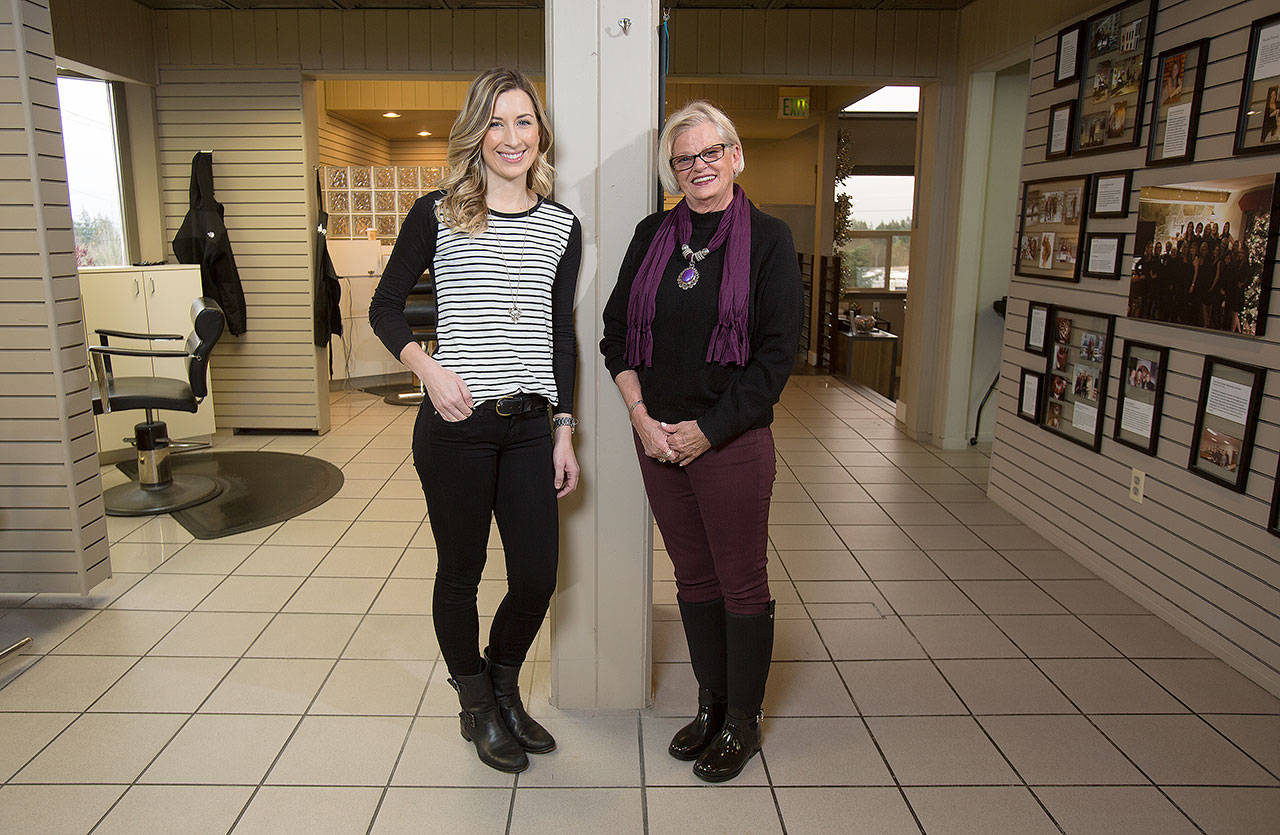 Longtime hair stylist Cynthia Mitchell (right), who established BreCyn Salon in Everett in 1986, retired on Wednesday. She is shown here in 2016 with Emily Douglas, now Emily Ochs, the co-worker to whom she turned over her salon that year. Mitchell continued to work there until last week. (Andy Bronson / Herald file)