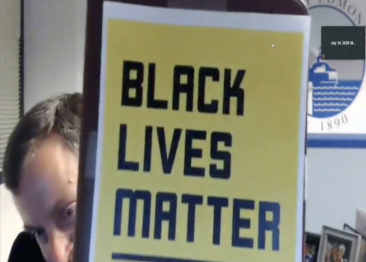 Edmonds Mayor Mike Nelson ended the July 14 council meeting by holding up a “Black Lives Matter” sign. (City of Edmonds)