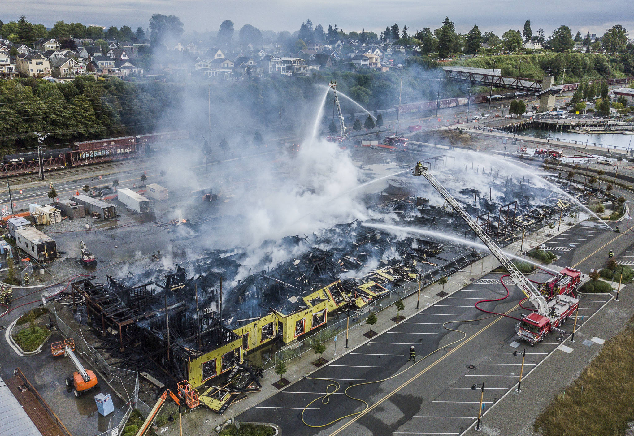 Smoke comes up from an apartment complex along West Marine View Drive that caught fire Thursday in Everett. (Olivia Vanni / The Herald)