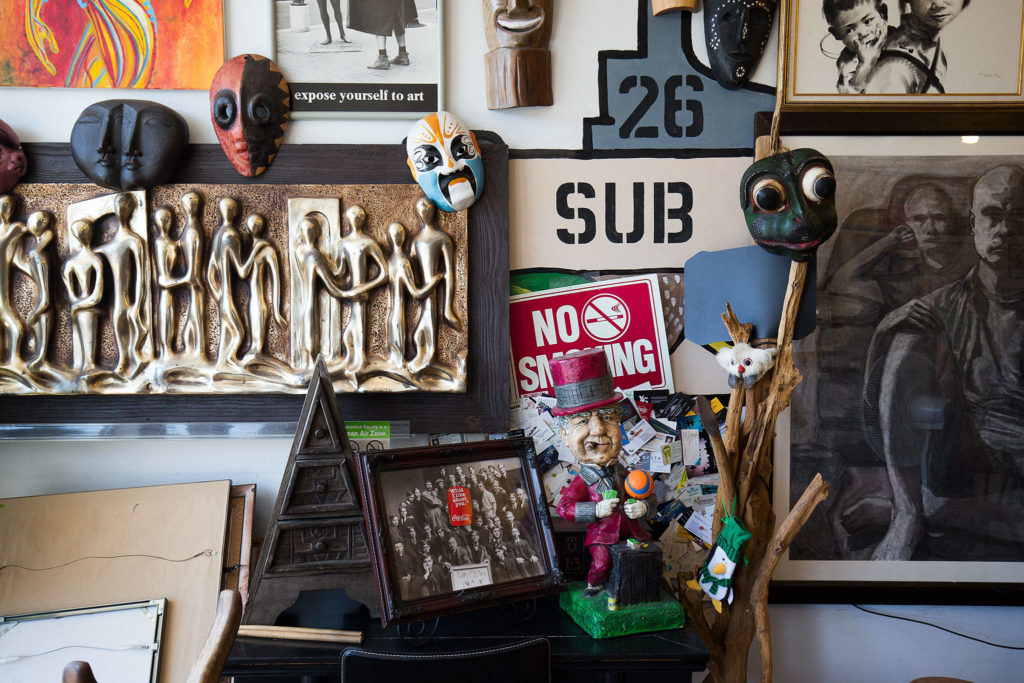 Wai Eng collects art and artifacts at thrift stores and yard sales to decorate his Sub Shop in Everett. (Andy Bronson / The Herald)
