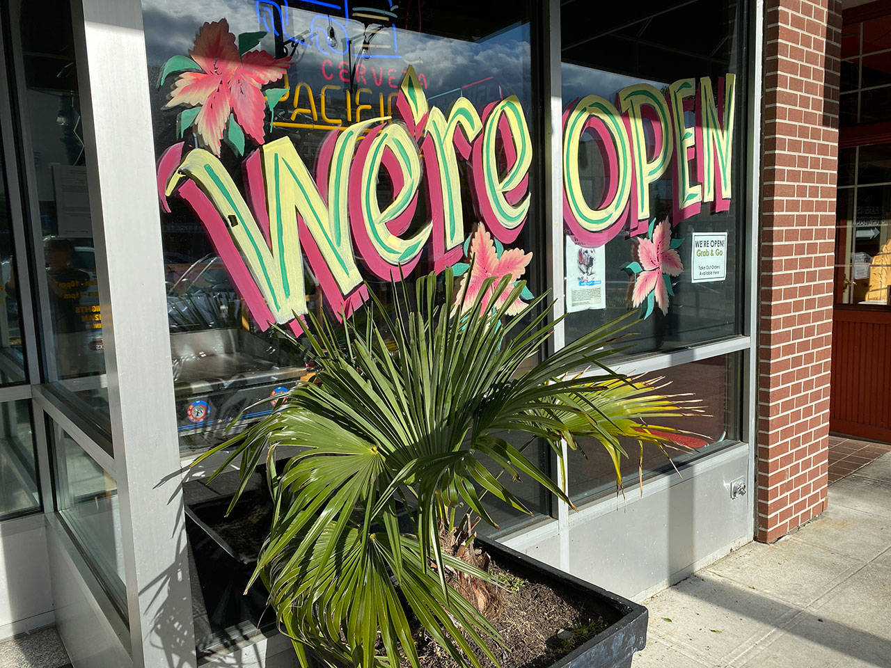As restaurants, retail stores, places of worship, barber shops and nail salons open with capacity restrictions, the unemployment rate has gone down. (Sue Misao / The Herald)
