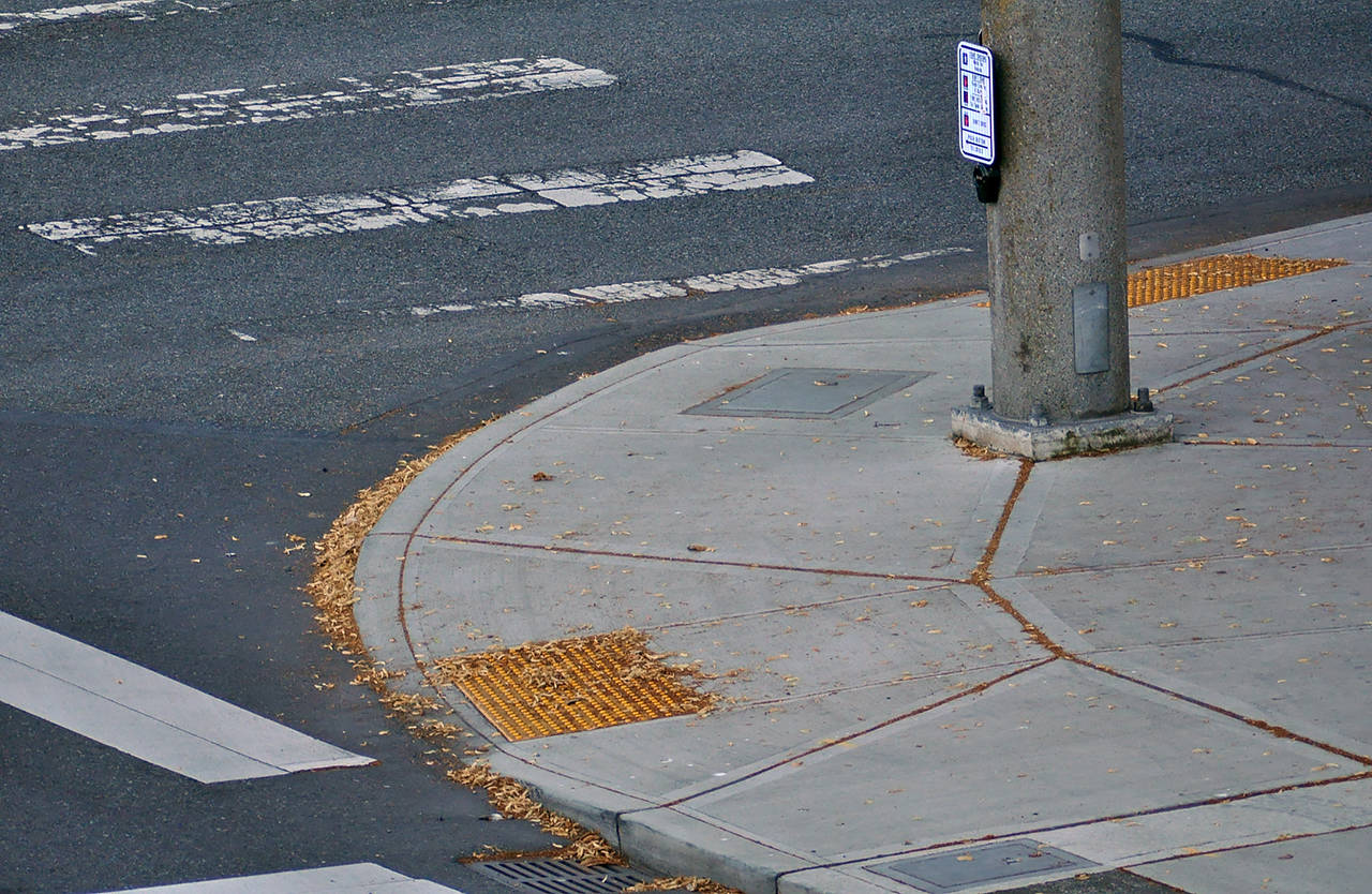 Thanks to the ADA, curb ramps have gentler slopes and road crossings that beep or click. (Herald file)