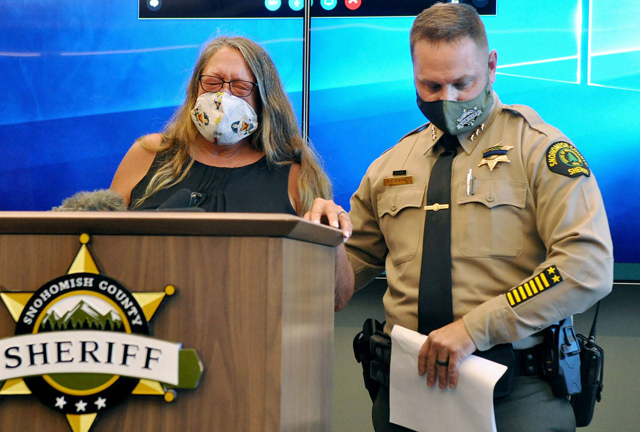Sharon Lee (left), mother of Melissa Lee, speaks to media Wednesday with Sheriff Adam Fortney. (Sue Misao / The Herald)