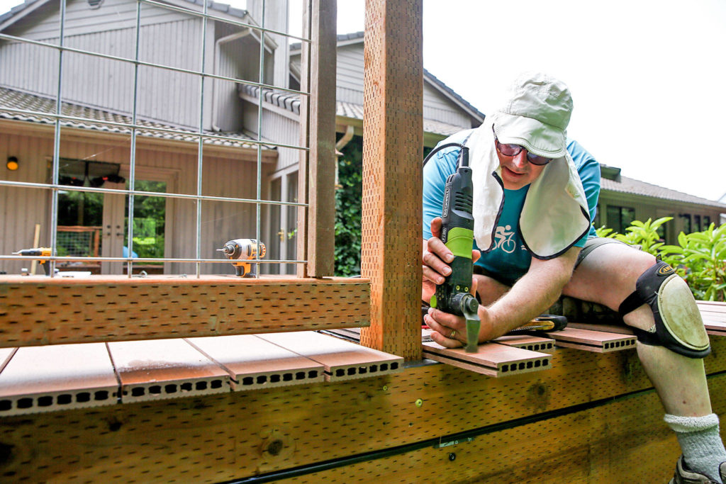 Rich Davis had never built anything before and made some mistakes. But “he’s a pro now,” wife Yumi Davis says. (Kevin Clark / The Herald)
