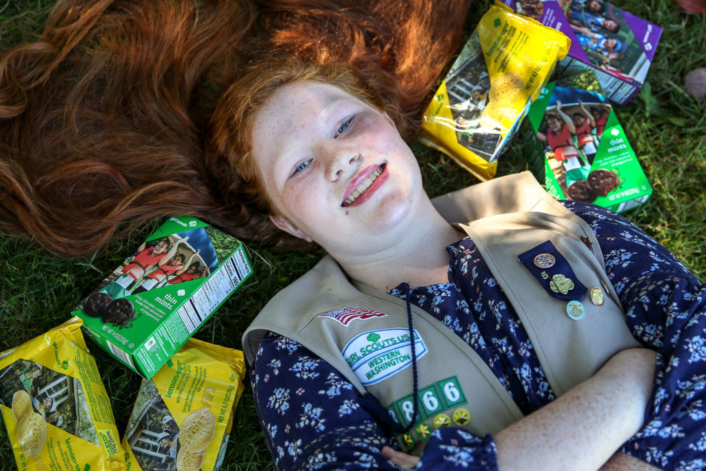 Preorders are Aly Gustavson’s cookie-selling secret. This year, she added a QR code to her door hangers that enabled her repeat customers to purchase Girl Scout cookies from her online. (Kevin Clark / The Herald)
