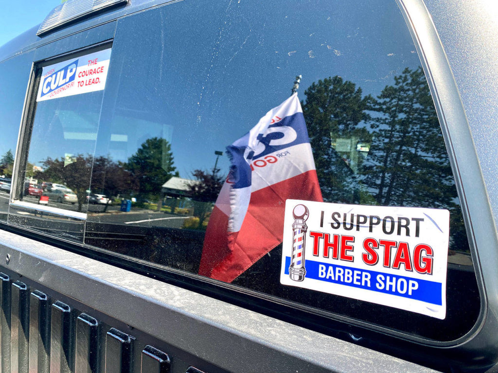 Photos by Andrea Brown 
 The Herald
A sticker on a pickup parked outside the Stag Barber Shop shows support for the Snohomish business.
