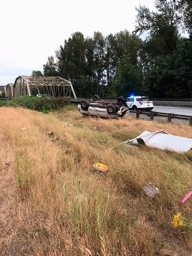A Dodge Durango left the roadway and rolled multiple times Friday. A 16-year-old boy died in the crash. (Washington State Patrol)