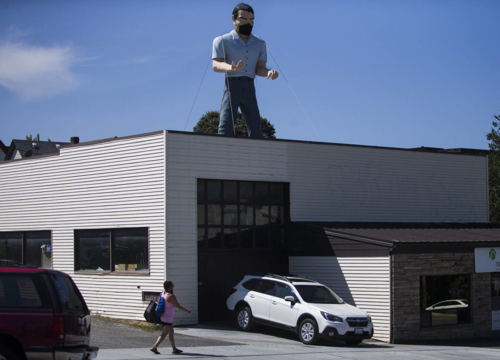 Building owner Boyce Cardell masked the Muffler Man a week ago after being urged to do so by the staff at the Soundview Bar Grill. (Olivia Vanni / The Herald)
