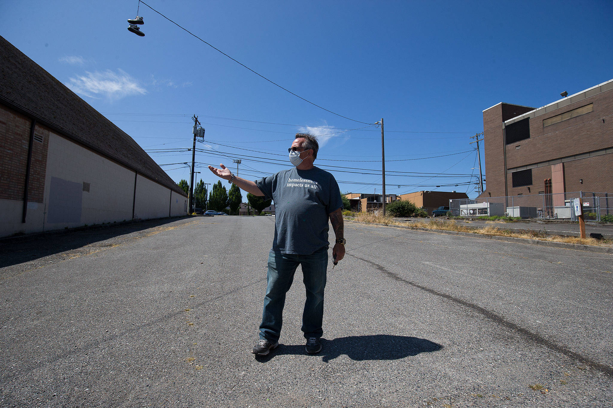 Jason Cockburn of Second Chance Foundation talks about the possibility of getting tents set up in the parking lot at Everett United Church of Christ. The church has applied to host an encampment. (Andy Bronson / The Herald)