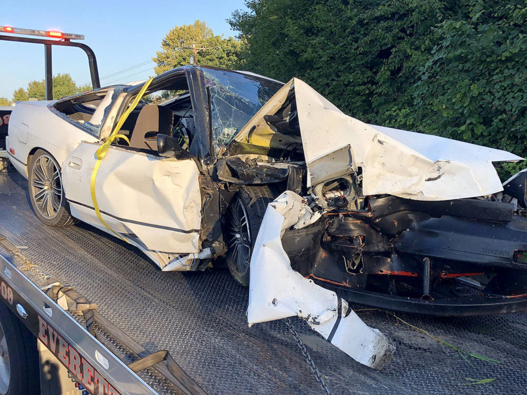 The passenger of a Nissan 240 was transported to Providence with serious leg injuries and head trauma. Both occupants of a Nissan Altima were transported to Providence with minor injuries. Drugs are suspected in being a contributing factor of the cause of the collision. (Washington State Patrol)
