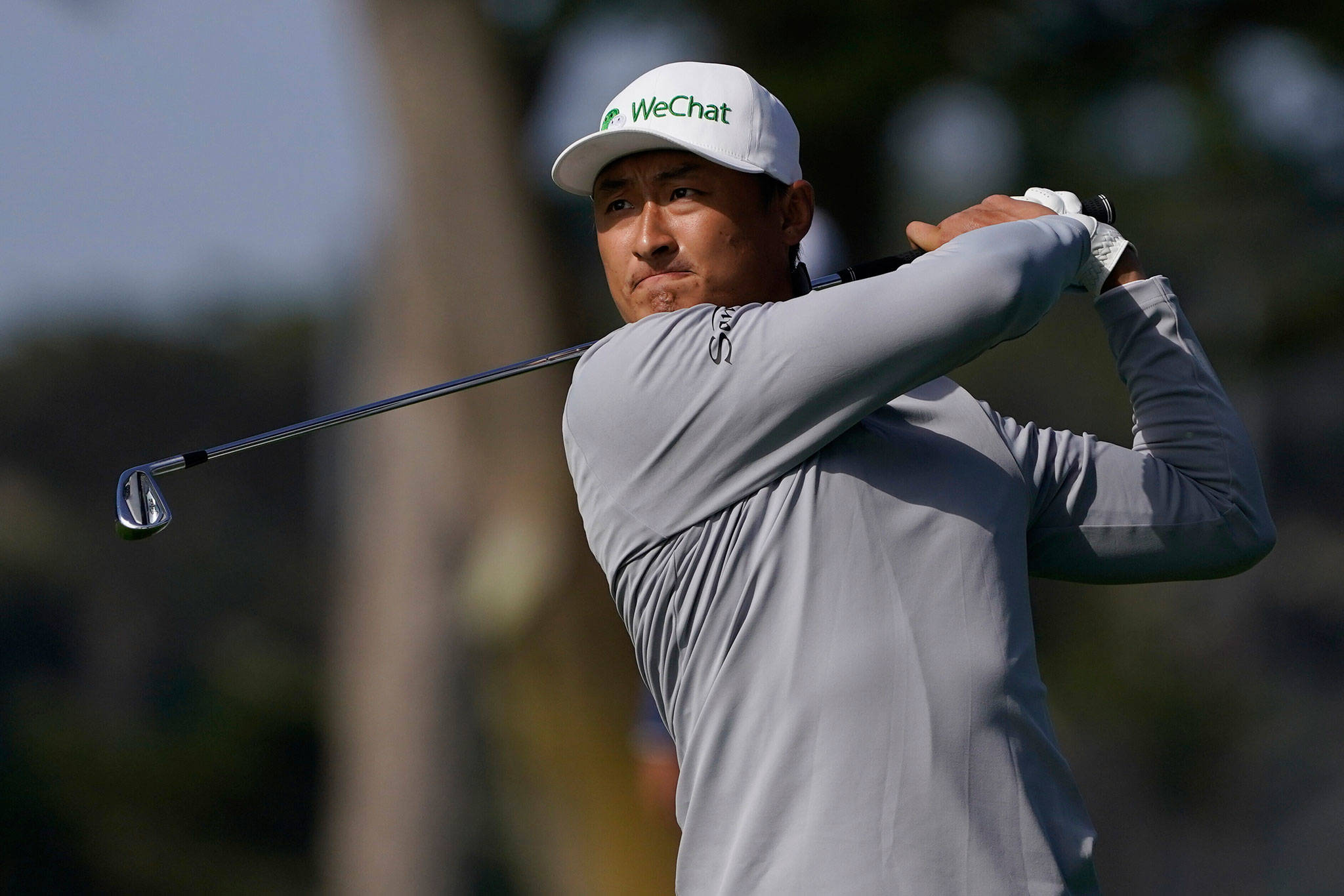 Li Haotong hits from the fairway on the 10th hole during the second round of the PGA Championship on Aug. 7, 2020, at TPC Harding Park Friday in San Francisco. (AP Photo/Charlie Riedel)