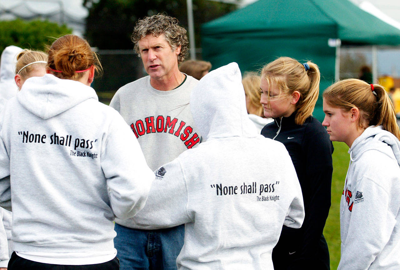 Dan Parker talks with his Snohomish High School runners before the start of the Wesco North Division championship race at Lakewood High School on Oct. 23, 2004. (Elizabeth Armstrong / Herald file)
