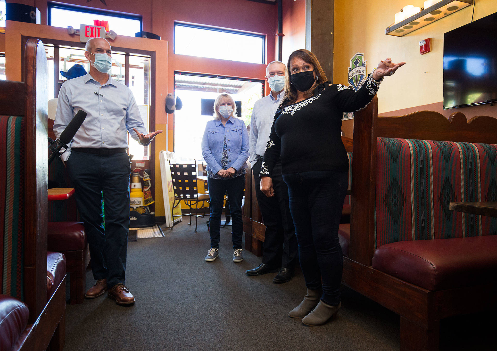 Congressman Rick Larsen chats with The New Mexicans owner Evie De Simone on Monday about how her restaurant benefitted from federal Paycheck Protection Program (PPP) in Everett. Larsen visited three Snohomish County businesses that benefitted from the federal PPP loans. (Andy Bronson / The Herald)