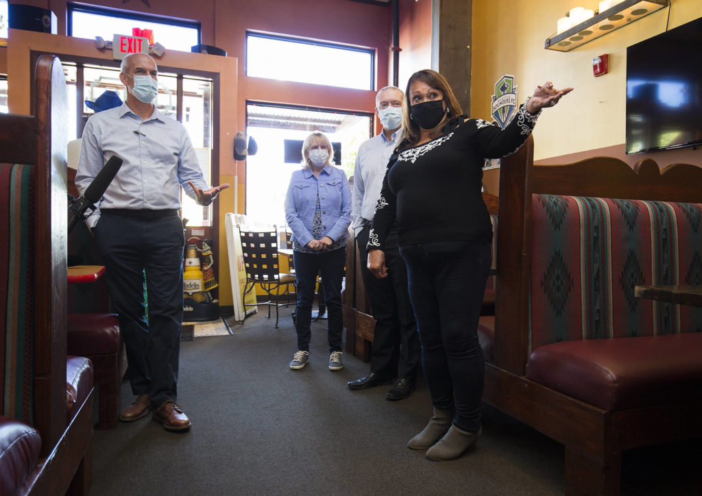 Congressman Rick Larsen chats with The New Mexicans owner Evie De Simone on Monday about how her restaurant benefitted from federal Paycheck Protection Program (PPP) in Everett. Larsen visited three Snohomish County businesses that benefitted from the federal PPP loans. (Andy Bronson / The Herald)
