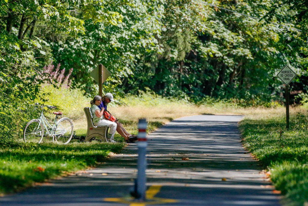 Centennial Trail stretches 30 miles from Snohomish to the Skagit County line north of Arlington, seen here. Its popularity apparently boomed during the past few pandemic months, leading to some concern about proper use and etiquette by motorized devices. (Kevin Clark / The Herald)
