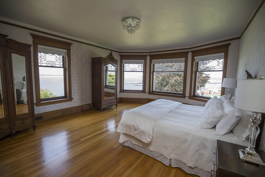 The Rucker Mansion’s main bedroom has views of the Olympic Mountains, Puget Sound and the Port of Everett. (Andy Bronson / The Herald)
