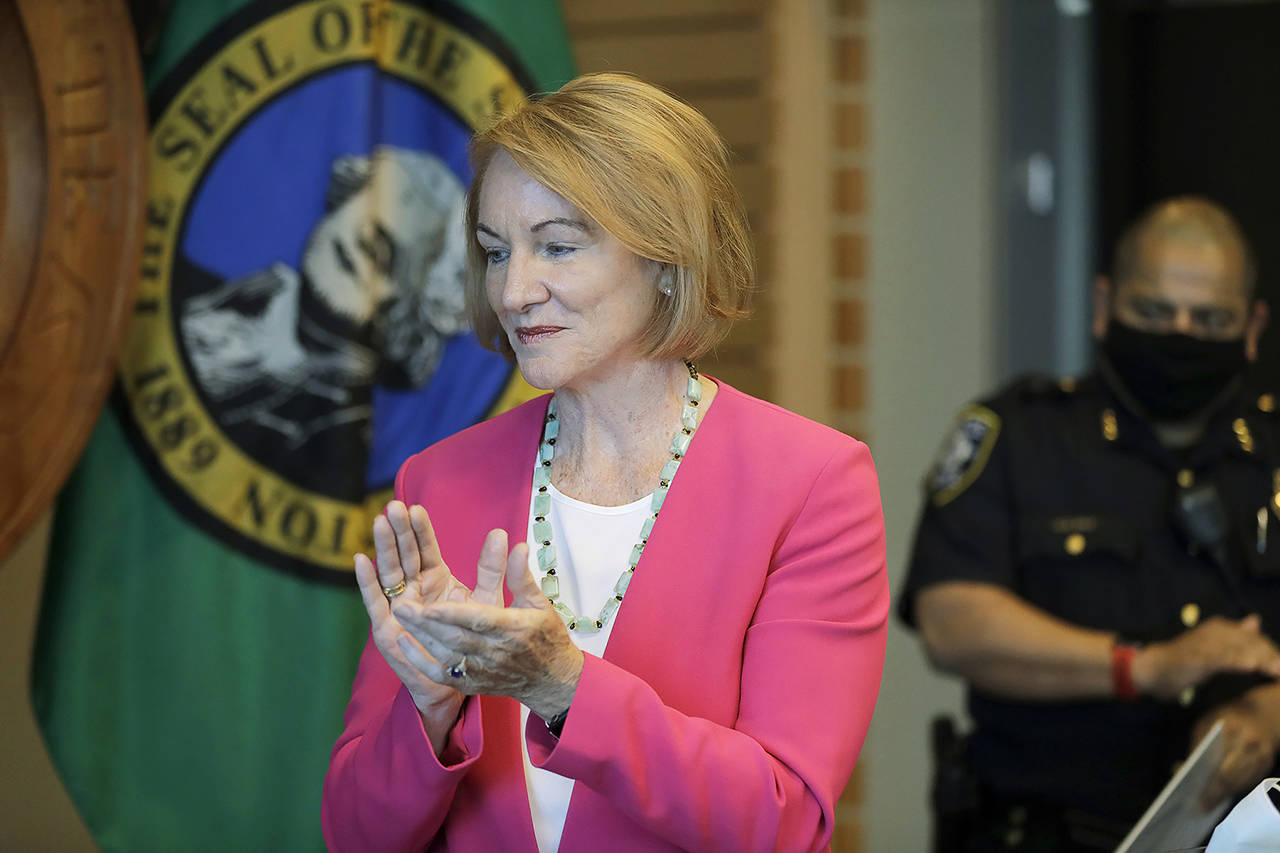 Seattle Mayor Jenny Durkan applauds after speaking during a news conference Aug. 11 in Seattle. (AP Photo/Ted S. Warren)