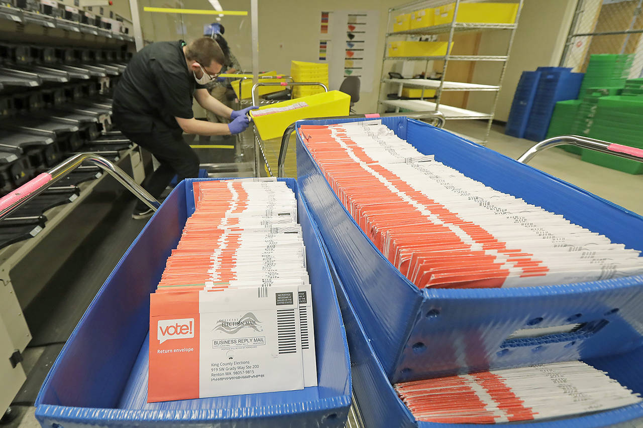 In this Aug. 5 photo, vote-by-mail ballots are shown in sorting trays at the King County Elections headquarters in Renton. (AP Photo/Ted S. Warren, File)