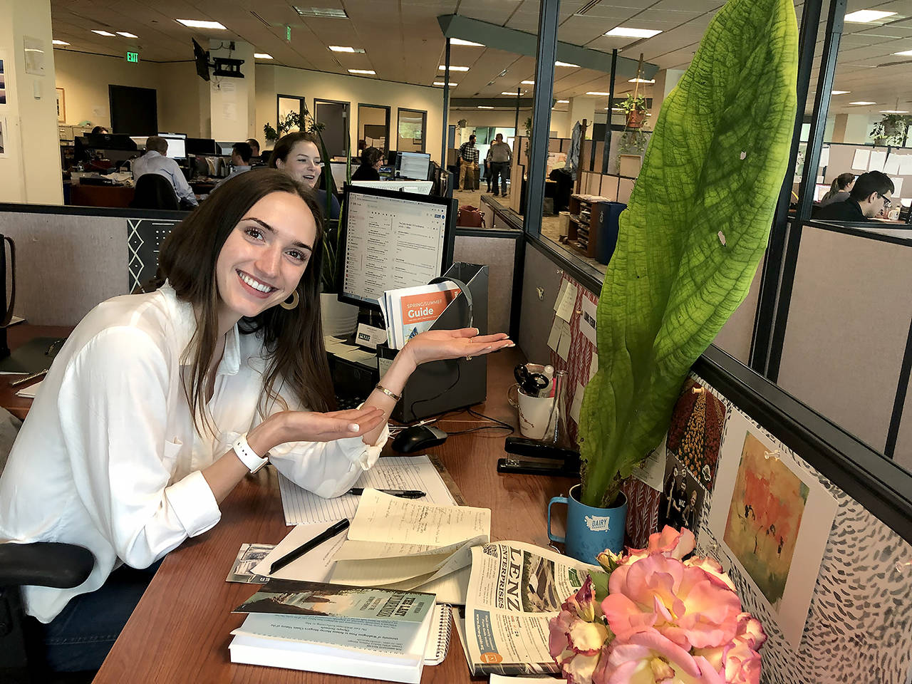 Herald reporter Julia-Grace Sanders appears to appreciate the gift of a giant leaf in 2019. (Andrea Brown / The Herald)