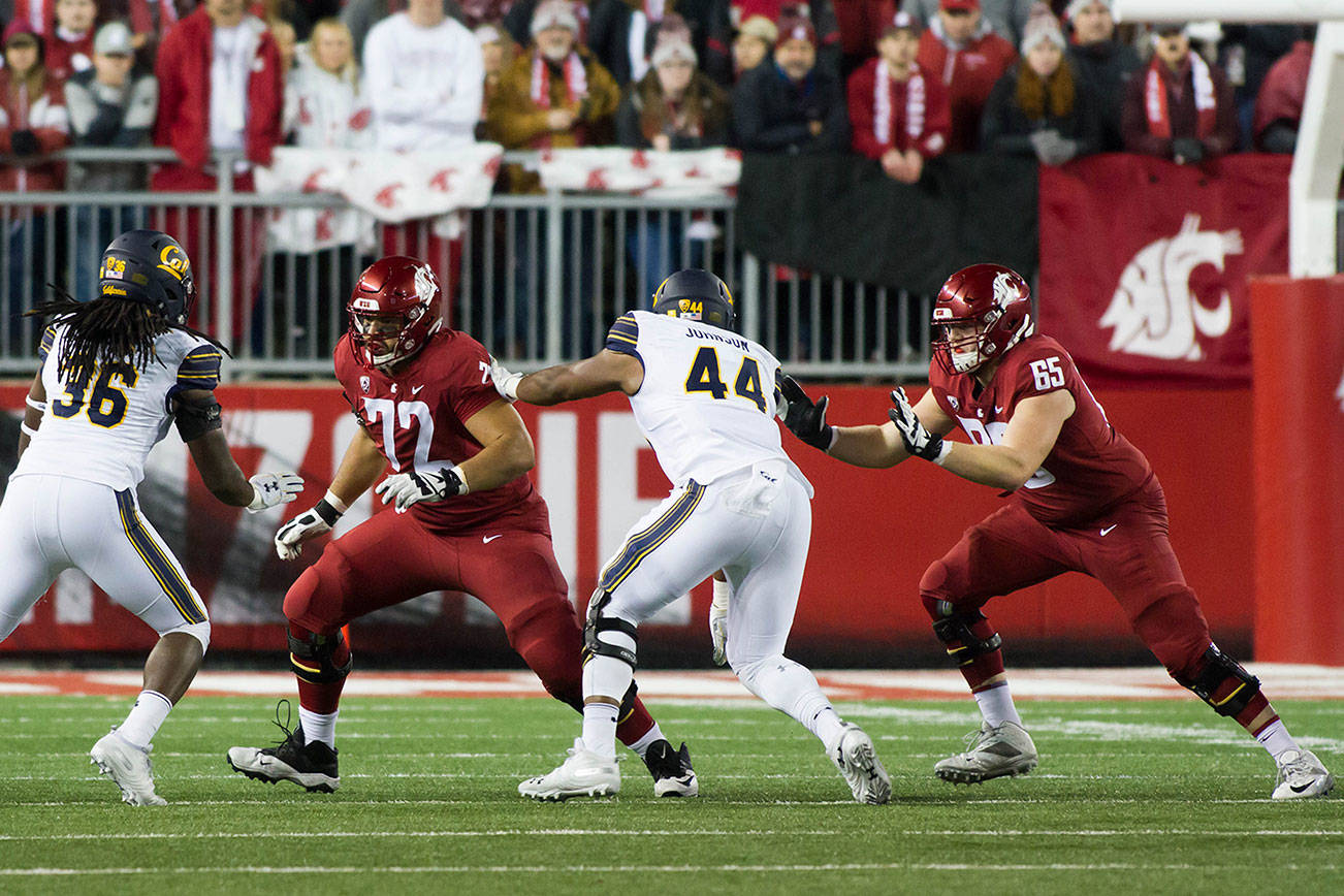 Local products Abe Lucas (72) and Josh Watson (65), along with the rest of the the Washington State University football team, won’t be playing this fall. (Washington State University photo)