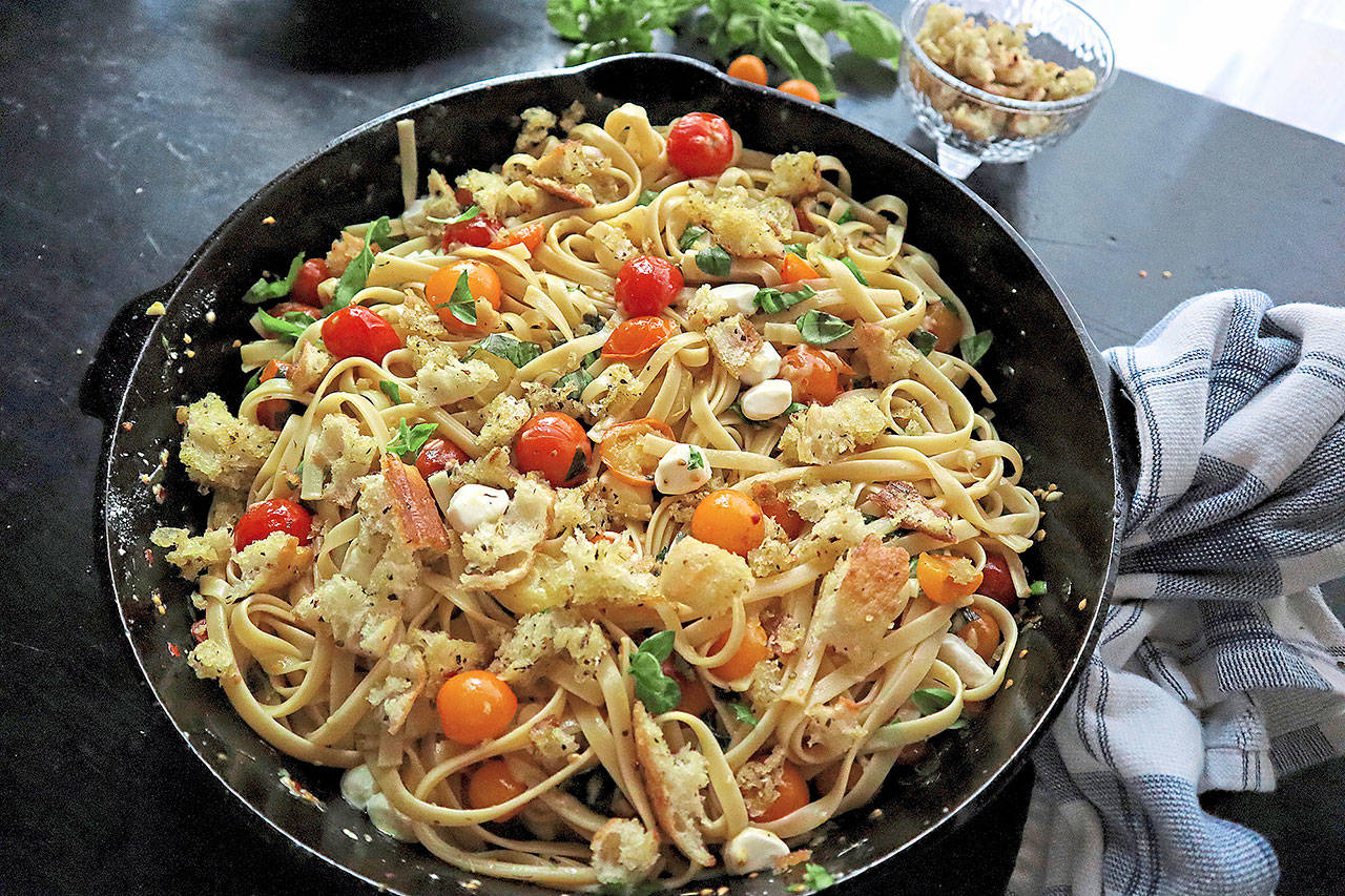Pasta tossed with charred cherry tomatoes, basil and mozzarella makes an easy and quick dinner. (Gretchen McKay / Pittsburgh Post-Gazette)