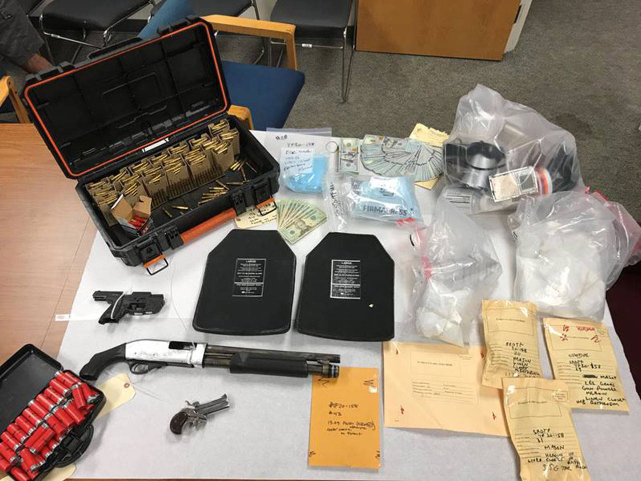 Officers and investigators found guns, body armor plates, fentanyl and heroin at a home in Lynnwood on July 25. (Snohomish County Sheriff’s Office)