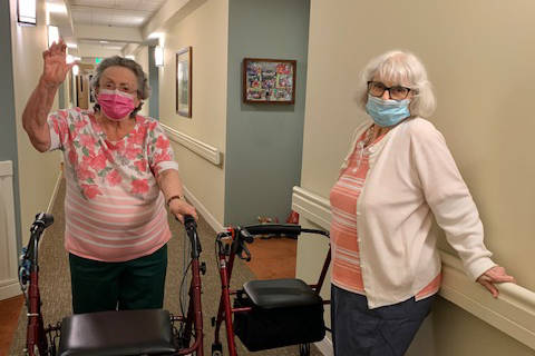 Gail and Alice chat in the hallway at Windsor Square.