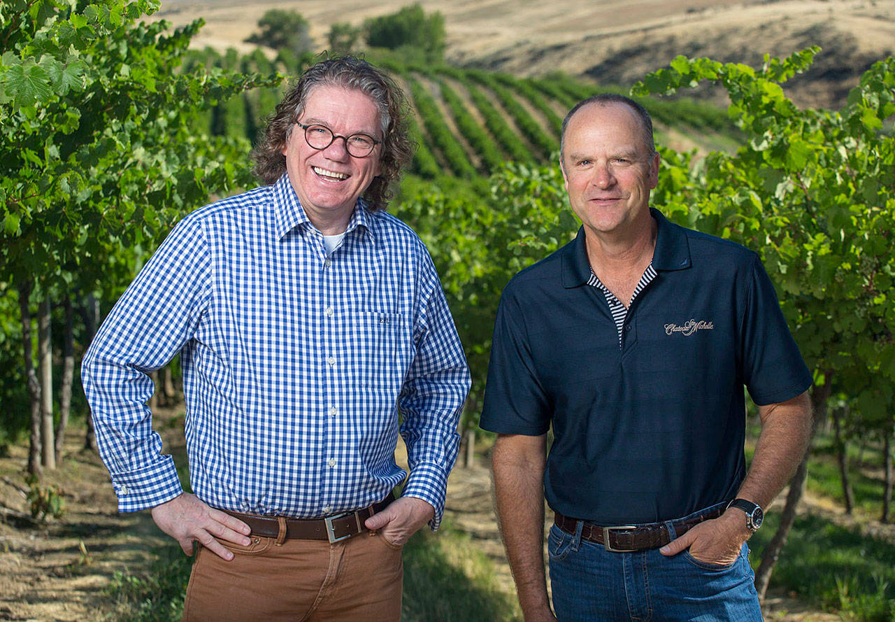 Ernst Loosen, left, and Bob Bertheau work with vines in Washington’s Columbia Valley to produce Eroica Riesling for the partnership that is Dr. Loosen in Germany and Chateau Ste. Michelle in Washington. (Ste. Michelle Wine Estates)