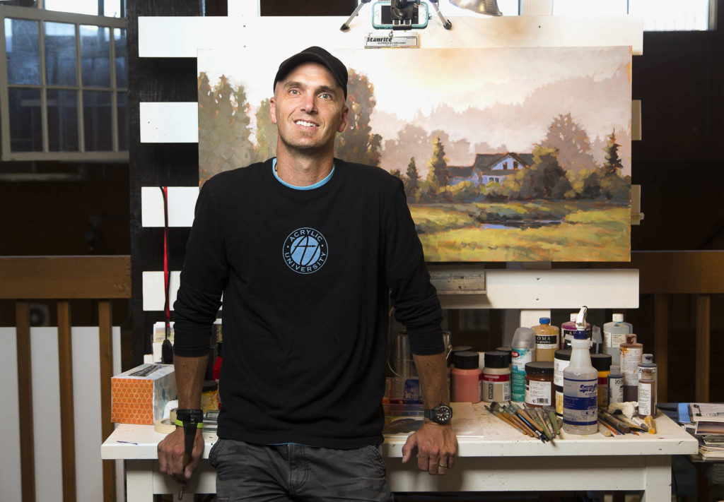 Camano Island artist Jed Dorsey is the director of Acrylic University and does a Friday art paint-and-giveaway event. (Andy Bronson / The Herald)
