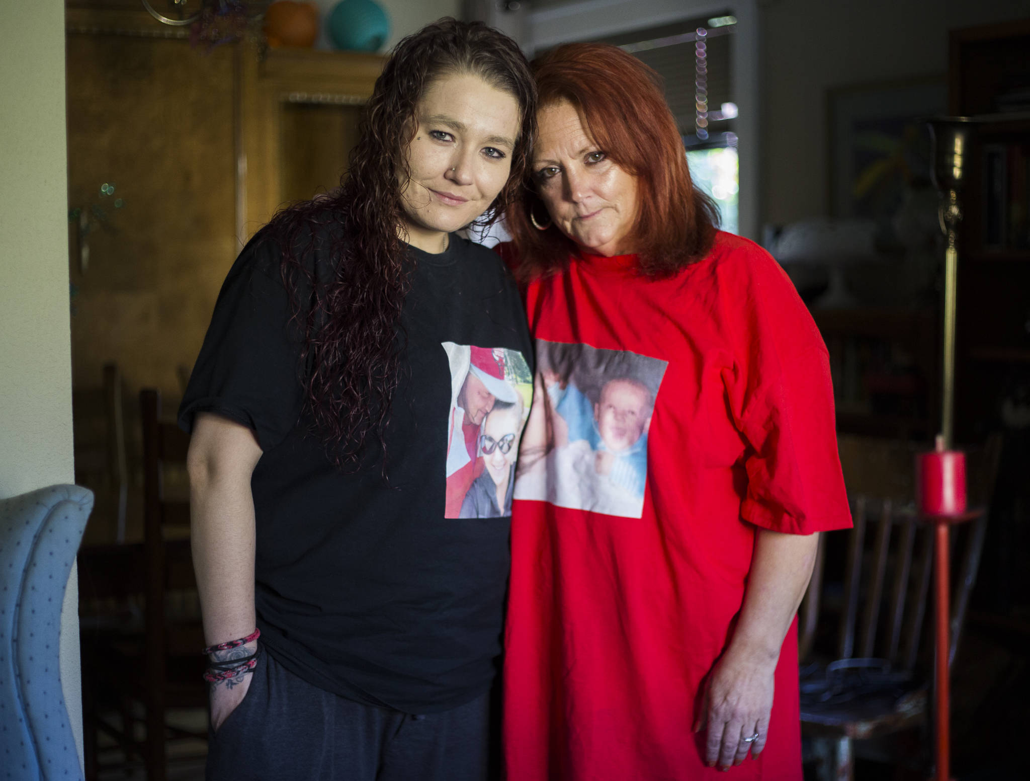 Justin Murphy’s partner Lathana Neese, left, and his mother, Kym Murphy, at their home on Thursday in Everett. (Olivia Vanni / The Herald)