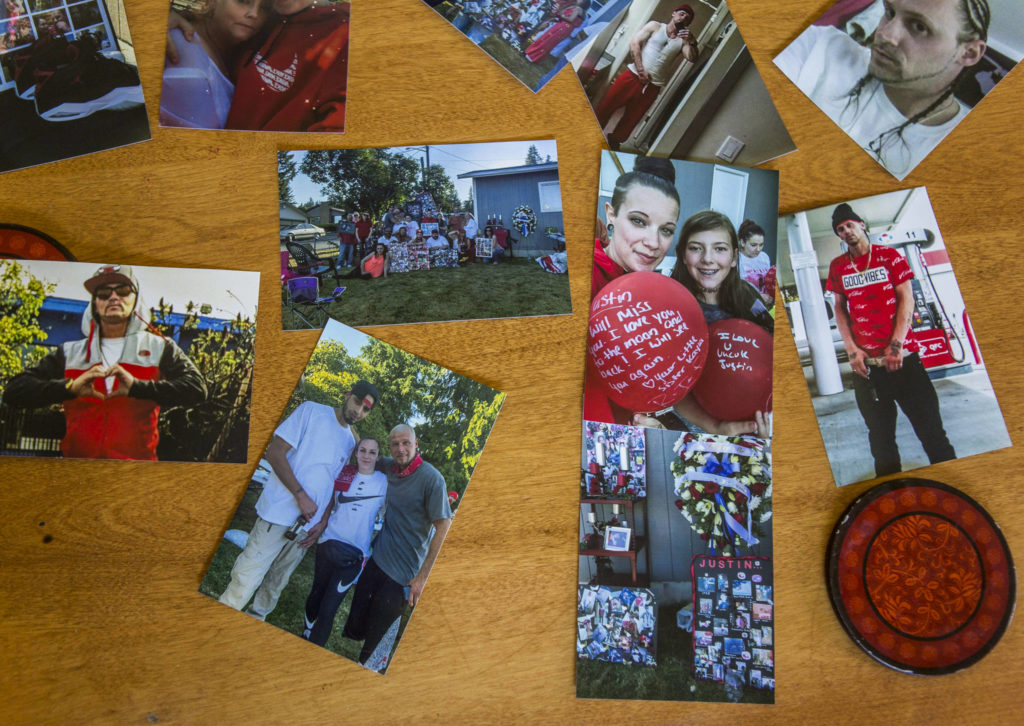 Photos of Justin Murphy, who died Aug. 4, along with pictures of friends and family at his Aug. 15 memorial in Everett. (Olivia Vanni / The Herald)
