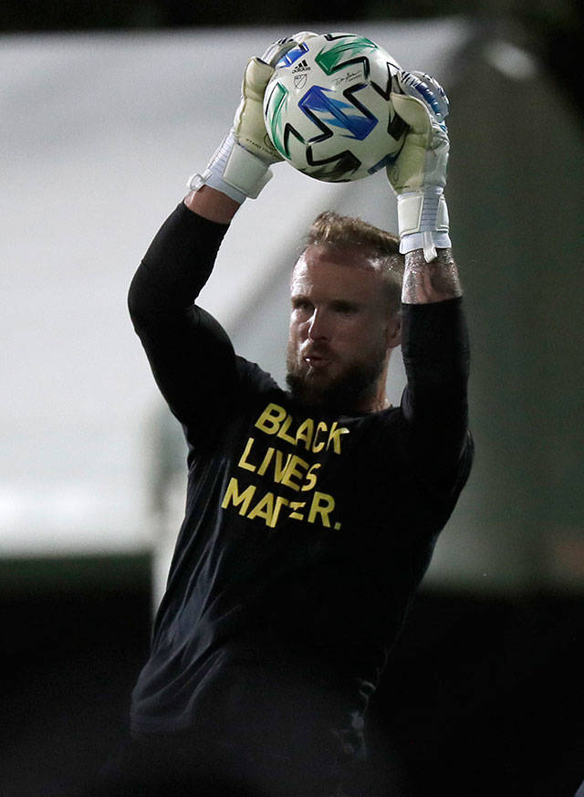 Sounders goalkeeper Stefan Frei warms up in a Black Lives Matter shirt before the start of an MLS match against the San Jose Earthquakes on July 10 in Kissimmee, Fla. (AP Photo/John Raoux)