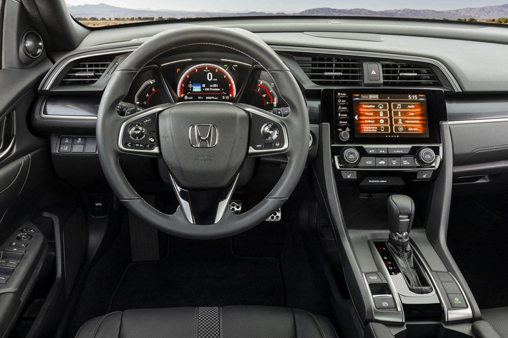 An infotainment system with 12-speaker premium audio, navigation, and Android Auto and Apple CarPlay capability is standard on the 2020 Honda Civic Hatchback Sport Touring model. (Manufacturer photo)

