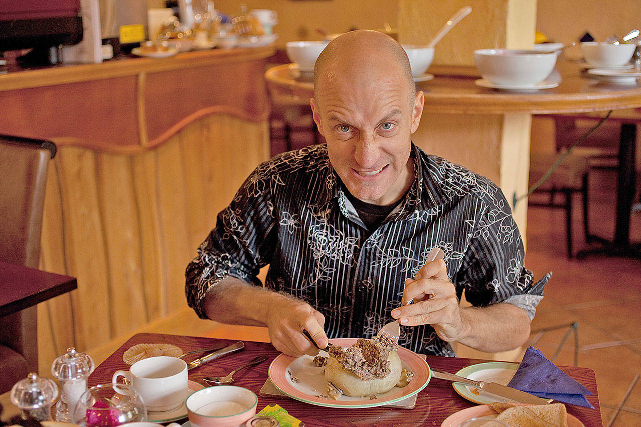Digging into a plate of haggis, the national dish of Scotland. (Rick Steves’ Europe)