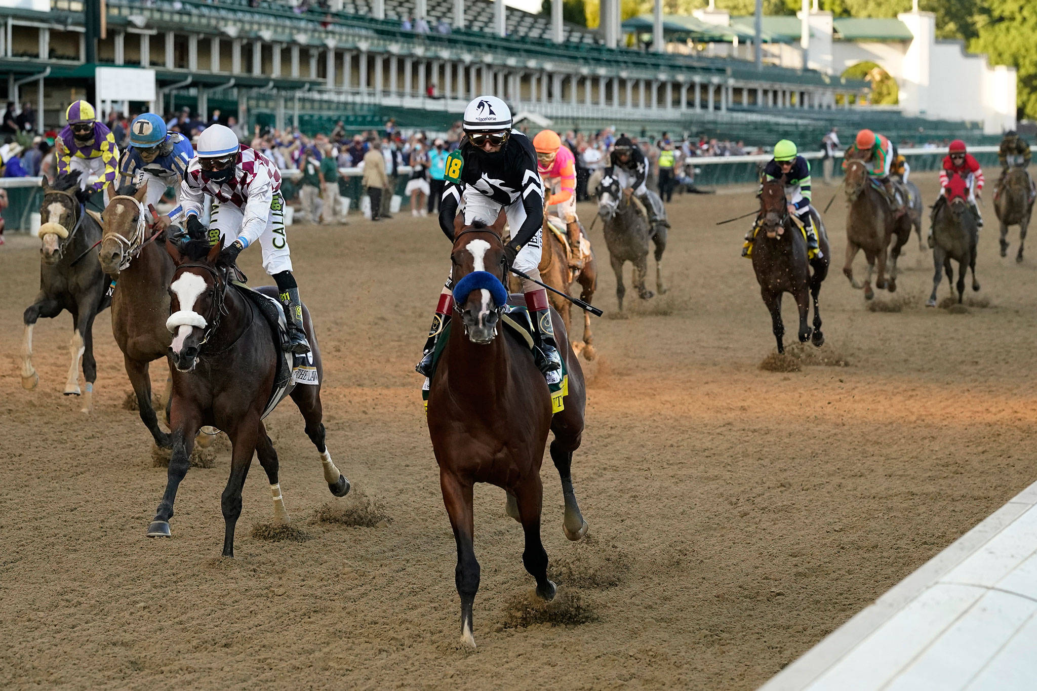 Jockey John Velazquez riding Authentic (18) crosses the finish line to win the 146th running of the Kentucky Derby on Saturday at Churchill Downs in Louisville, Ky. (AP Photo/Jeff Roberson)