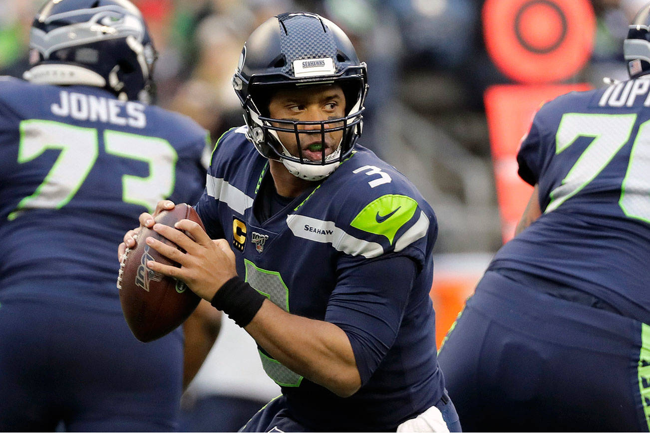 Russell Wilson and the Seattle Seahawks have lofty goals for the 2020 NFL season. (AP Photo/Lindsey Wasson)