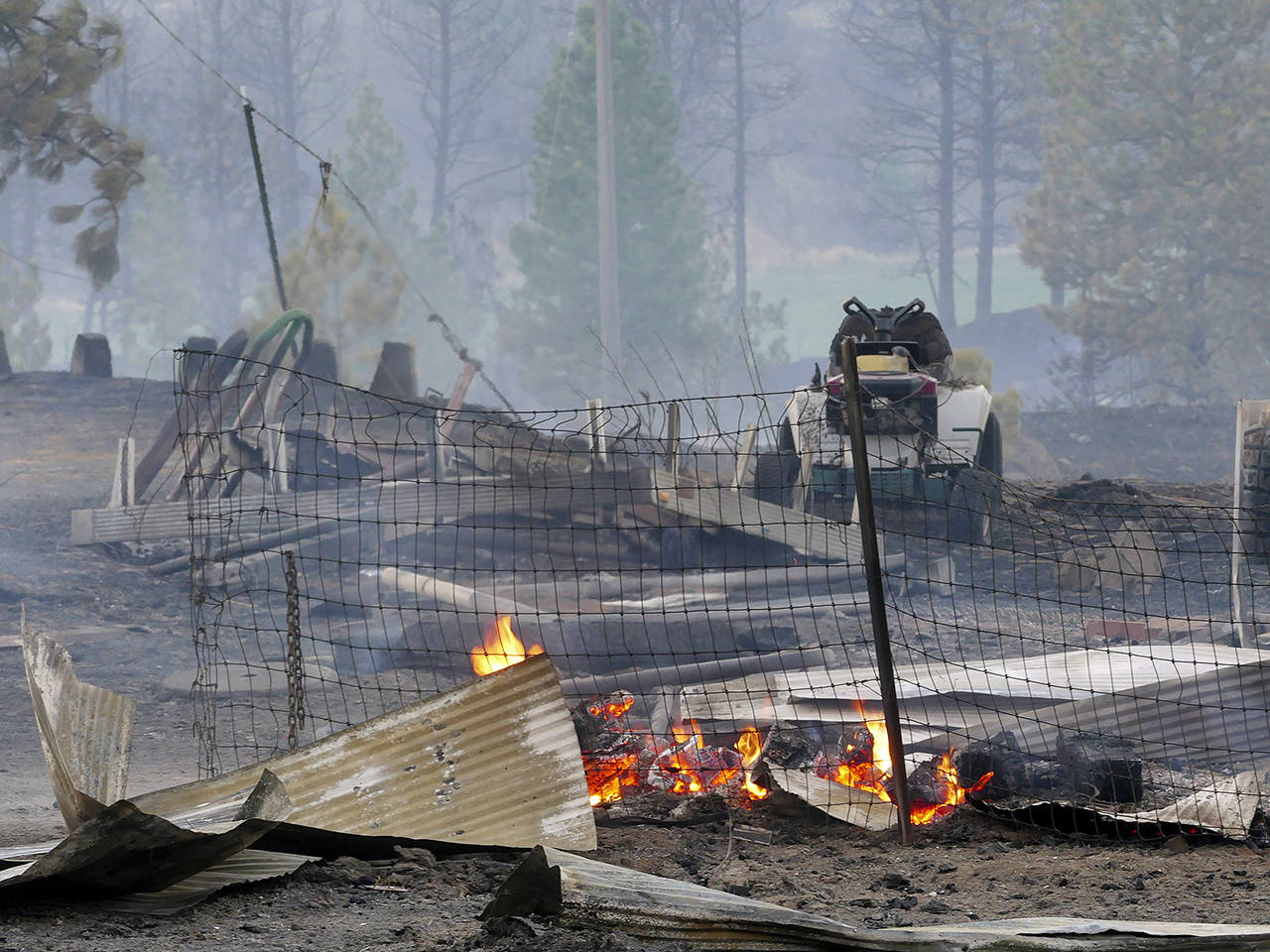 Charred rubble remains after a wildfire decimated the small town of Malden, Washington, on Monday, destroying an estimated 70% of homes in the northern Whitman County community. (Jesse Tinsley/The Spokesman-Review via AP)