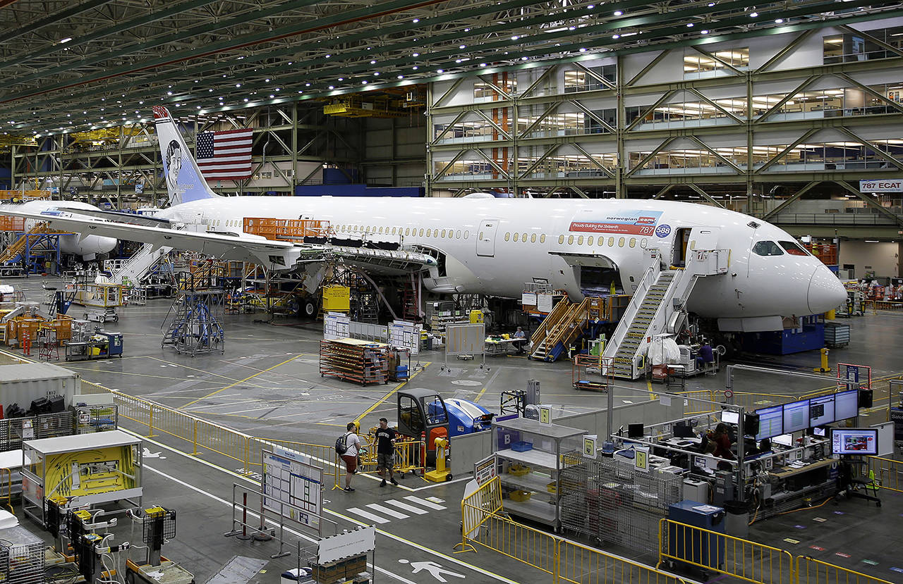 In this 2017 photo, a Boeing 787 airplane being built for Norwegian Air Shuttle is shown at Boeing Co.’s assembly facility in Everett. (AP Photo/Ted S. Warren, File)