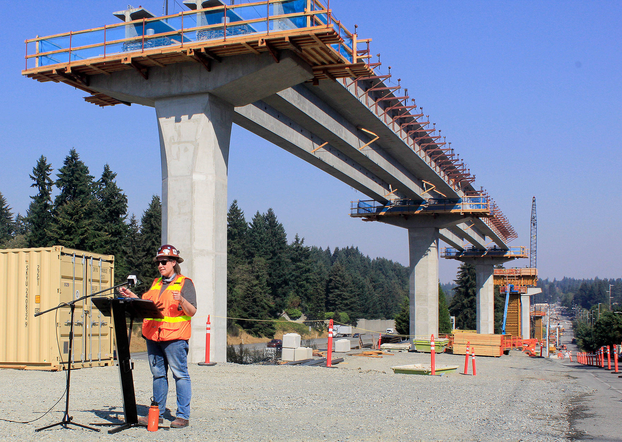 Sound Transit construction manager Ginger Ferguson talks to reporters on Wednesday at a construction site for the 130th Street station in Seattle, part of the light rail extension to Lynnwood. (Joey Thompson / The Herald)