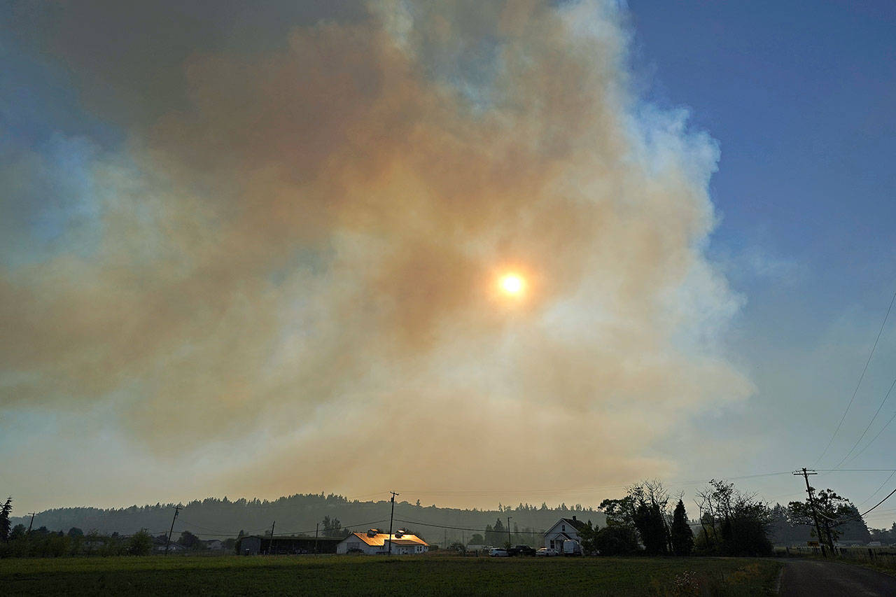 Wildfire smoke fills the air near Sumner, south of Seattle. (AP Photo/Ted S. Warren)