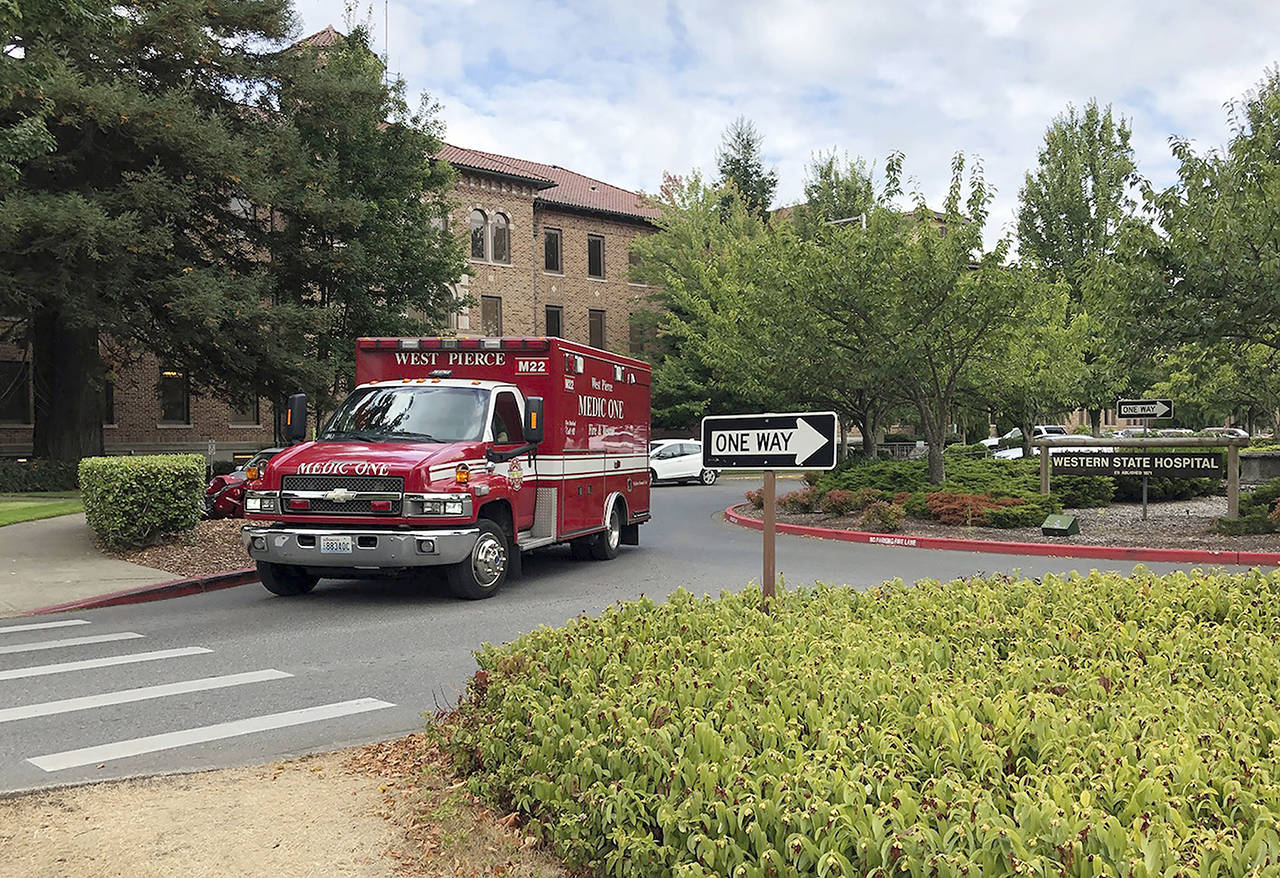 In this 2018 photo, an ambulance leaves Western State Hospital in Lakewood. (AP Photo/Martha Bellisle, File)