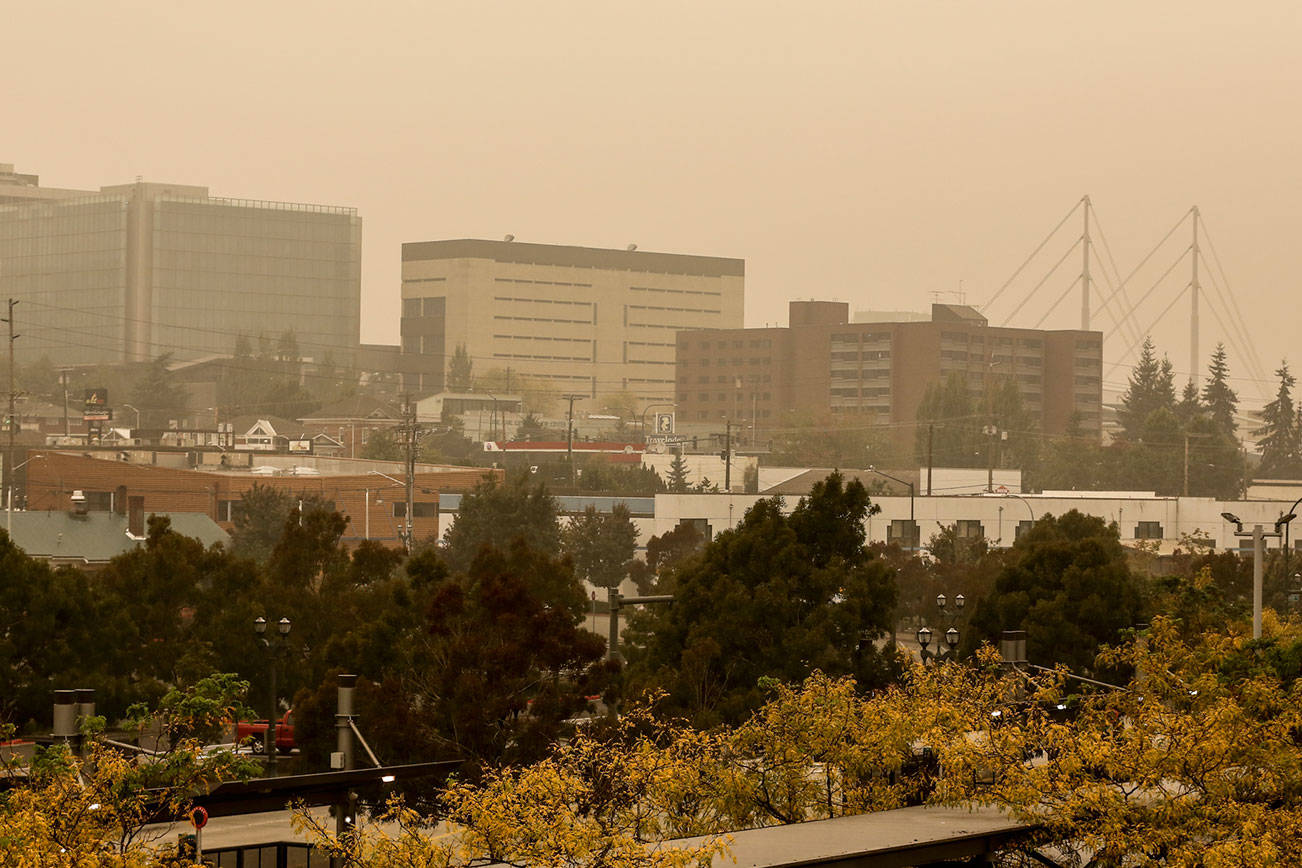 A yellow haze settles over the fiery Pacific Northwest