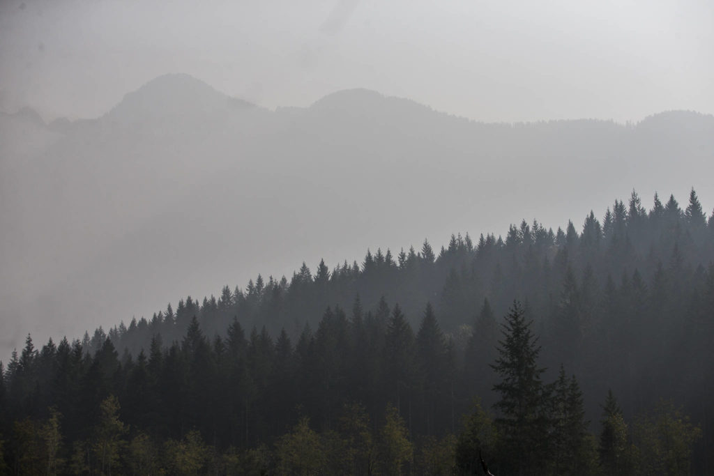 The ridge line of Jumbo Mountain is barely visible through the wildfire smoke on Friday, Sept. 11, 2020 in Darrington, Wa. (Olivia Vanni / The Herald)

