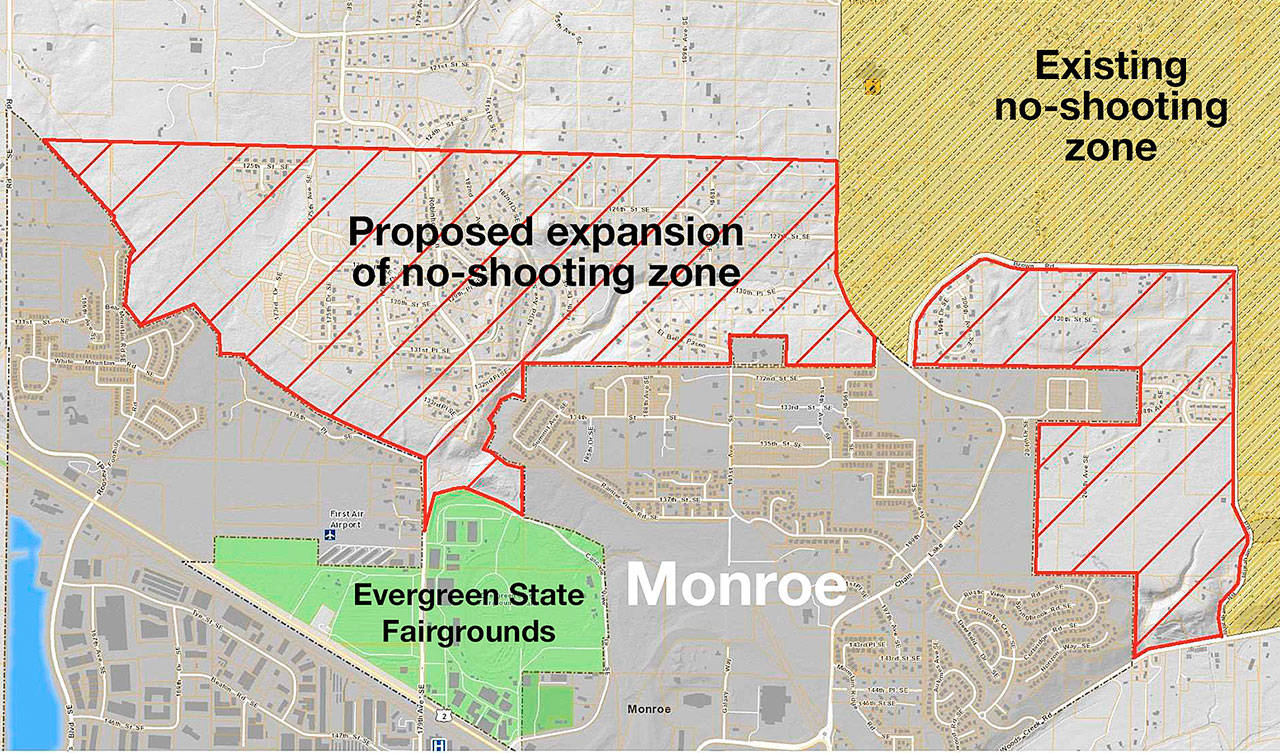 The Snohomish County Council on Wednesday will consider expanding a no-shooting zone to include land north and east of the city of Monroe. The yellow area on the map shows the county’s current no-shooting zone. The red-hatched area shows the proposed expansion, where shooting would become illegal. The gray area is the city of Monroe, where shooting is already illegal. (Snohomish County)
